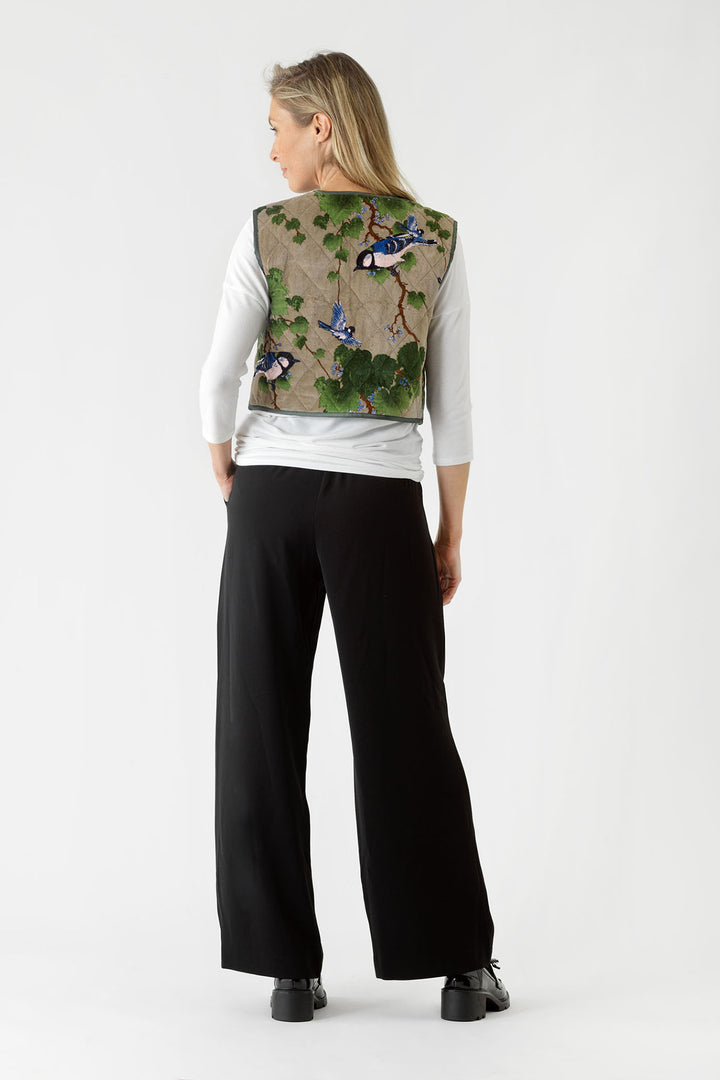 Cropped tie front velvet ladies gilet with green maple leaf pattern on a stone background by One Hundred Stars