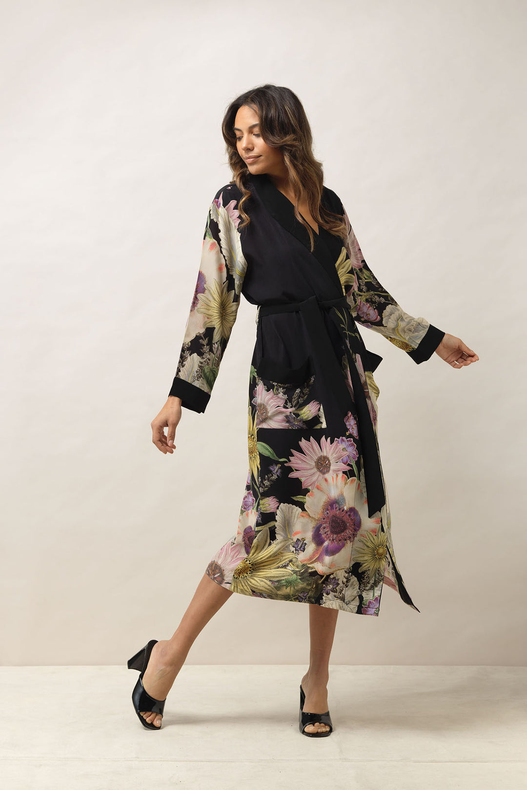 ladies crepe dressing gown with a floral daisy print on a black background by One Hundred Stars