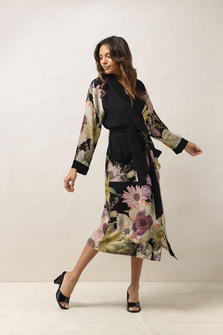 ladies crepe dressing gown with a floral daisy print on a black background by One Hundred Stars