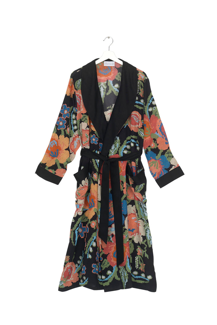 ladies crepe dressing gown in woven flower print featuring colourful flowers on a black background by One Hundred Stars