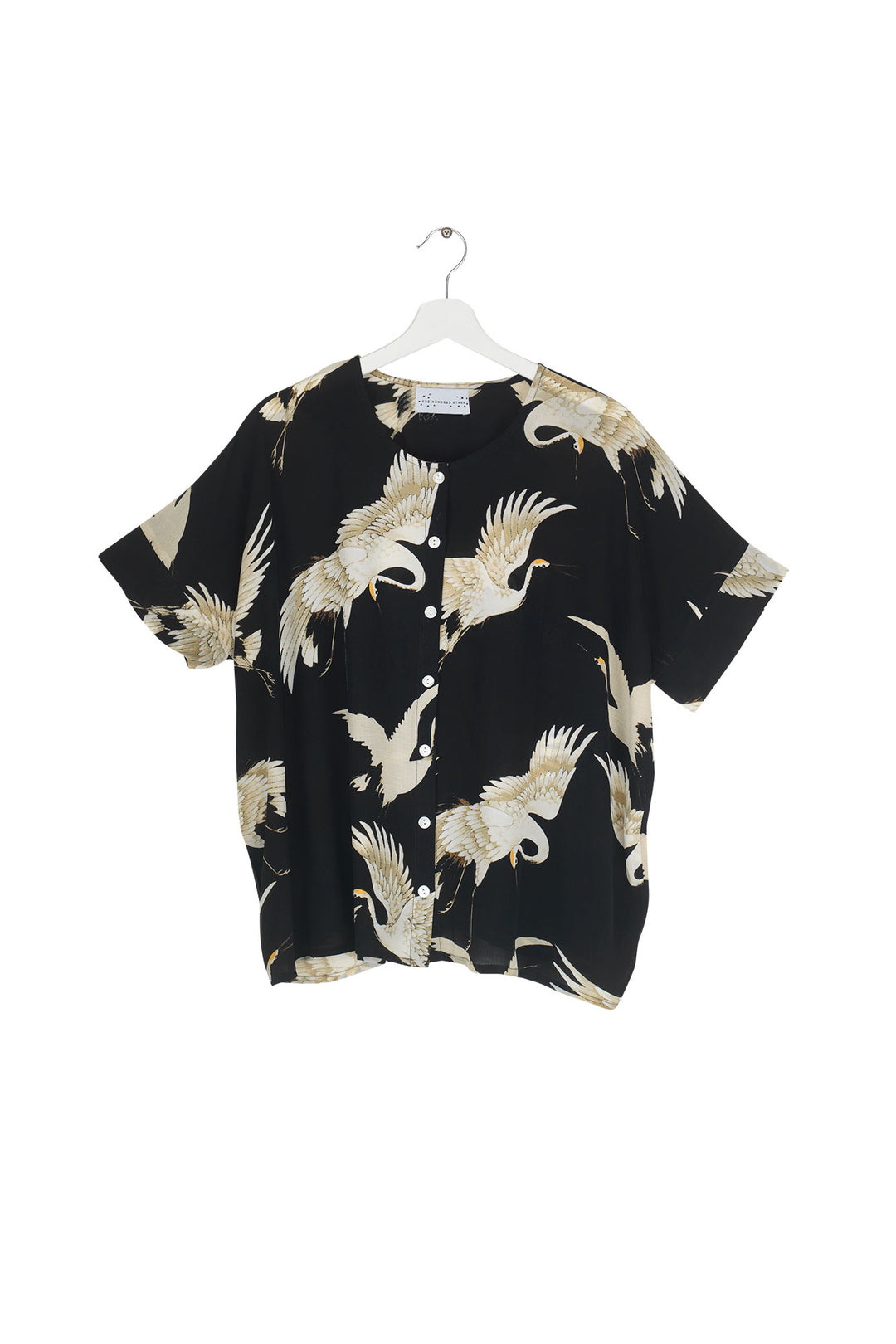 Women's short sleeve button up blouse in black and white stork print by One Hundred Stars