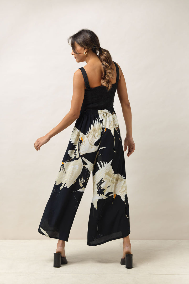 Ladies palazzo crepe pants black background with stork bird print by One Hundred Stars