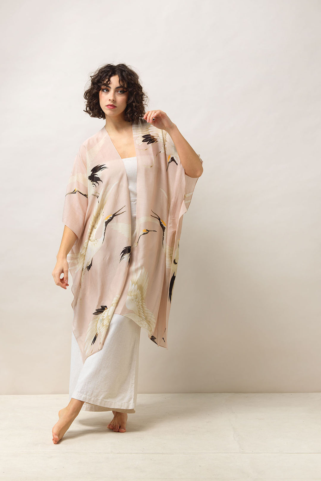 Women's lightweight throwover shawl in plaster pink and white stork print by One Hundred Stars