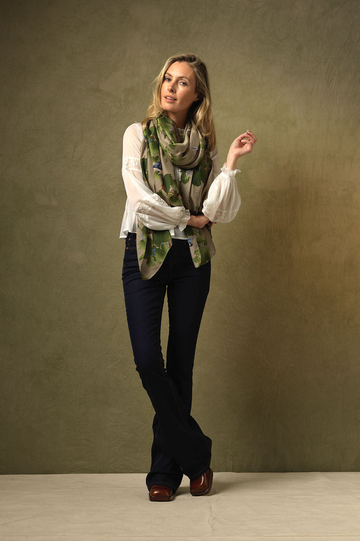 Winter ladies scarf with green maple leaf pattern on a stone background by One Hundred Stars