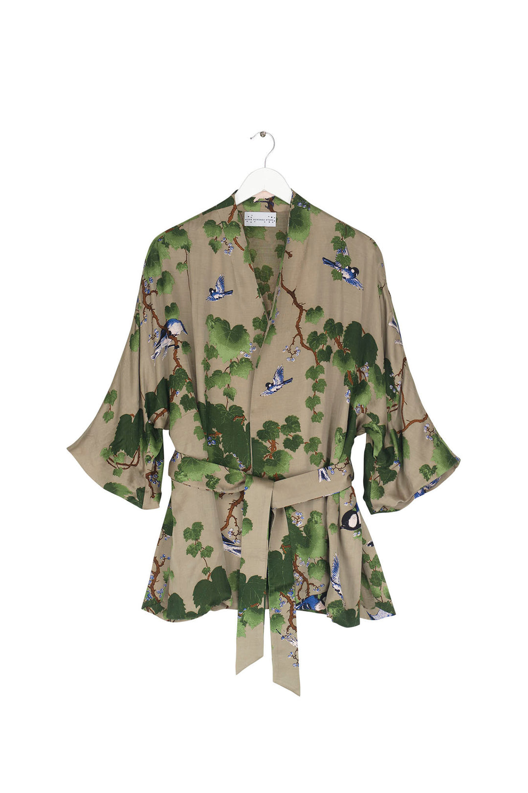 Satin ladies wrap jacket with green maple leaf pattern on a stone background by One Hundred Stars