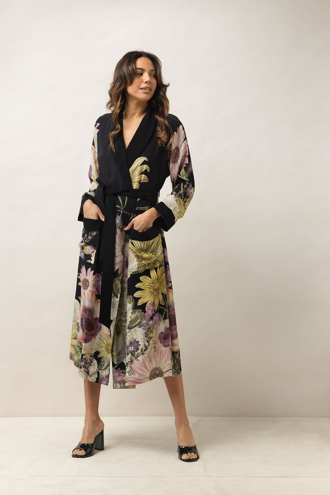 ladies crepe dressing gown with a floral daisy print on a black background by One Hundred Stars