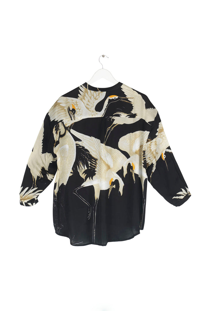 long sleeve ladies blouse satin black background with stork bird print by One Hundred Stars