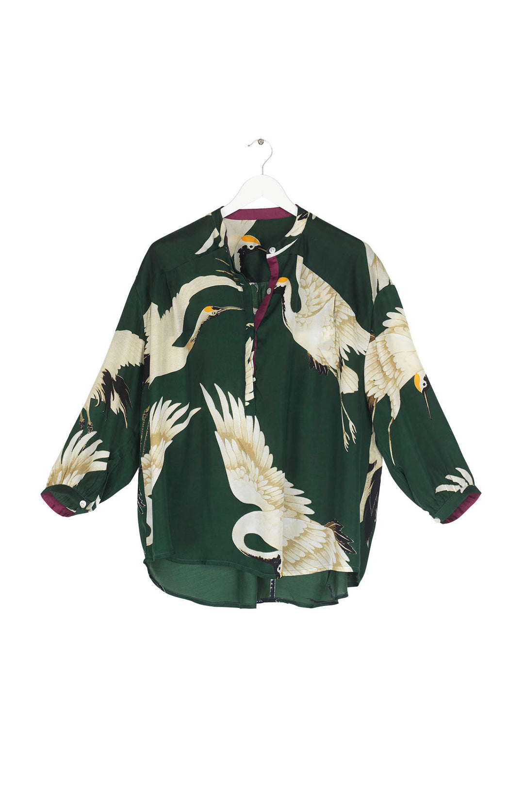 ladies button up satin shirt green background with stork bird print by One Hundred Stars