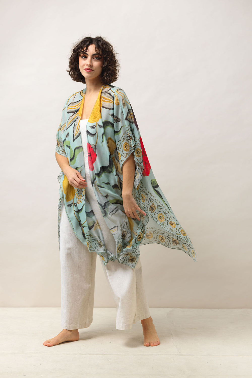 Women's lightweight throwover shawl in aqua with floral joy print by One Hundred Stars