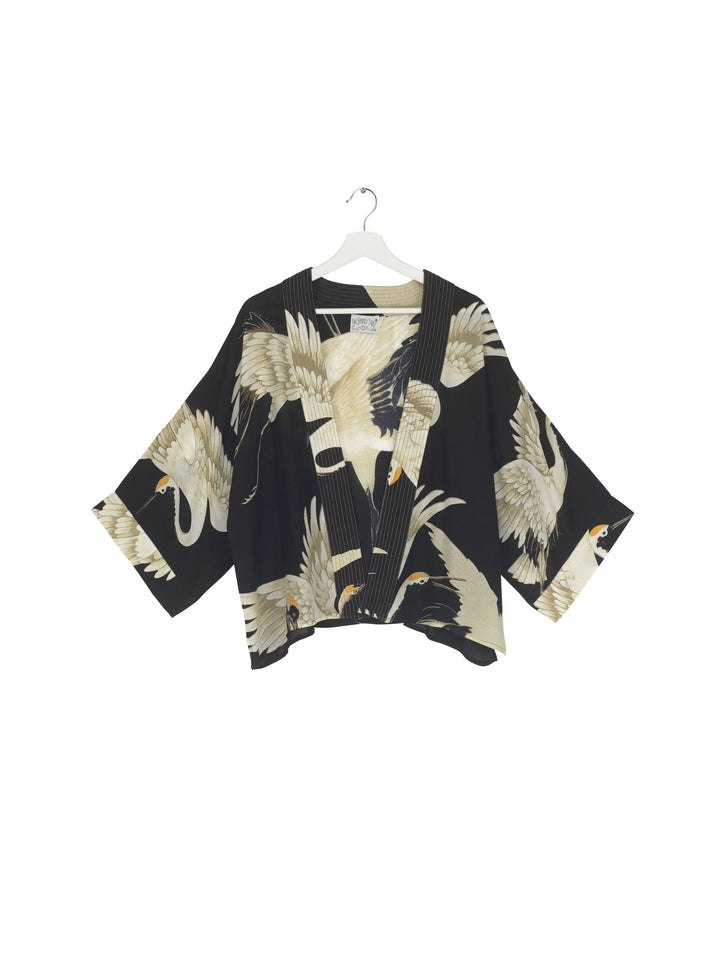 ladies short kimono jacket black background with stork bird print by One Hundred Stars