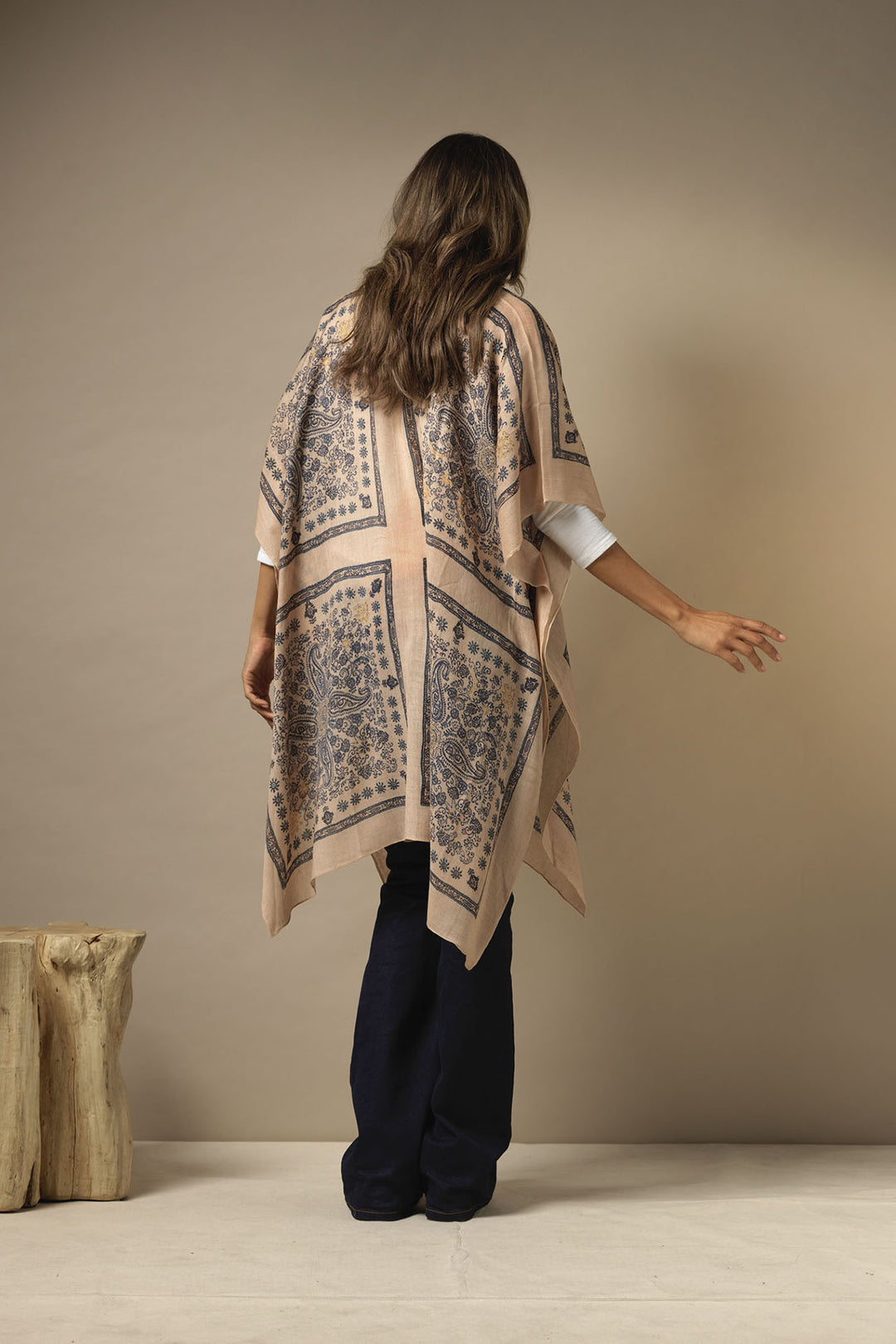 ladies wool winter throwover kaftan shawl with mehndi blue print on a light brown background by One Hundred Stars