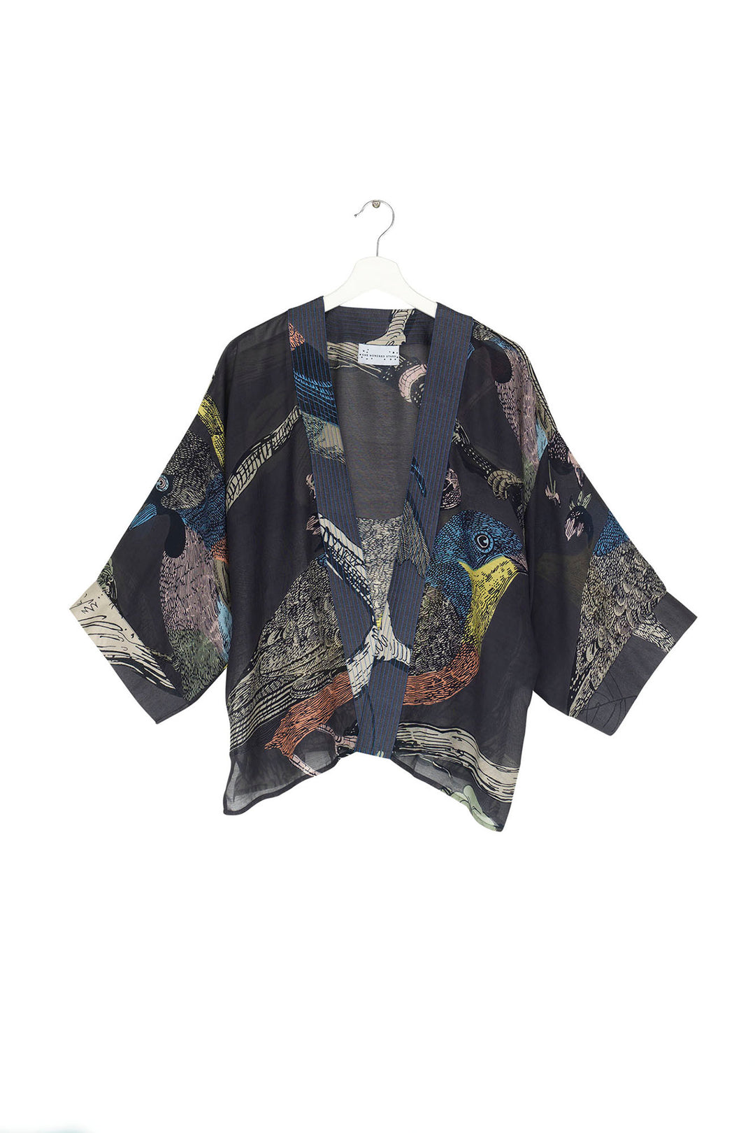 ladies short kimono jacket with a colourful bird print on a dark navy background by One Hundred Stars