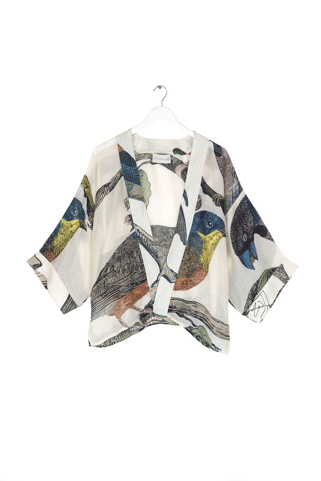 ladies short open front kimono with a colourful bird print on a light stone background by One Hundred Stars