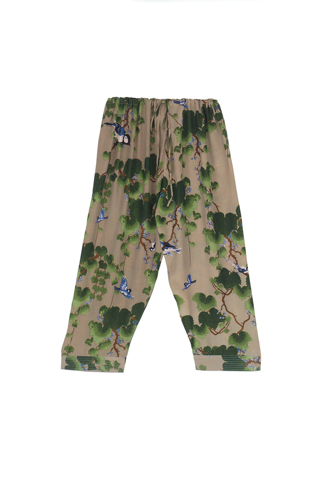 crepe cropped ladies trousers with green maple leaf pattern on a stone background by One Hundred Stars