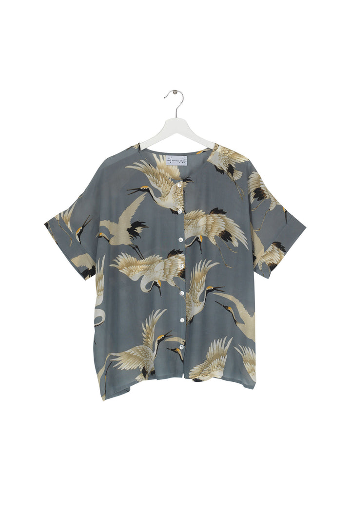 Women's short sleeve button up blouse in slate grey and white stork print by One Hundred Stars