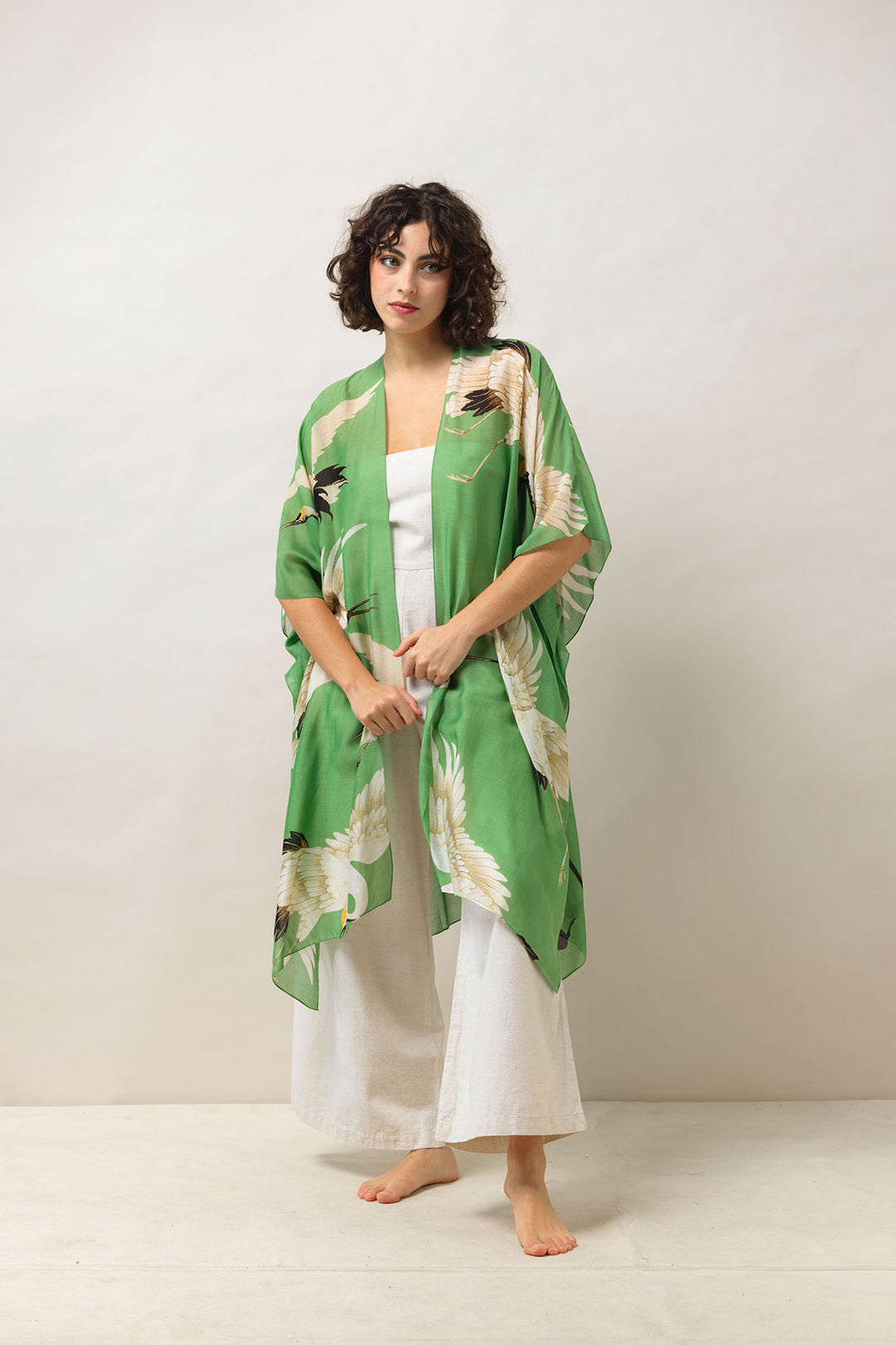 Women's lightweight throwover shawl in pea green and white stork print by One Hundred Stars