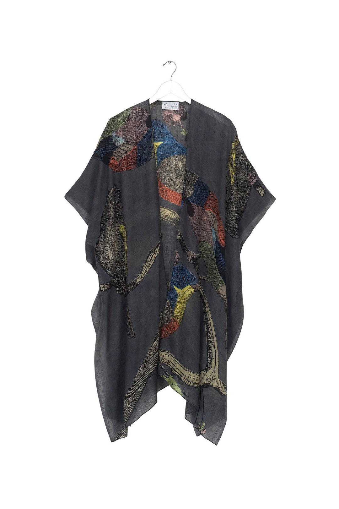 winter wool throwover ladies shawl kaftan with a colourful bird print on a dark grey background by One Hundred Stars