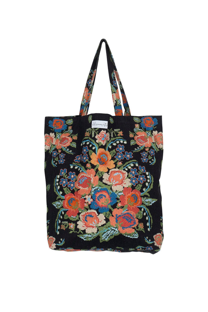 ladies large canvas tote bag in woven flower print featuring colourful flowers on a black background by One Hundred Stars