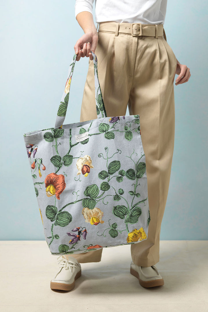 This 100% sustainable cotton bag, is just as versatile as it is beautiful. Whether it becomes your go to reusable shopping bag, a classic tote for keeping your books in or a chic beach bag, this print is sure to turn heads!