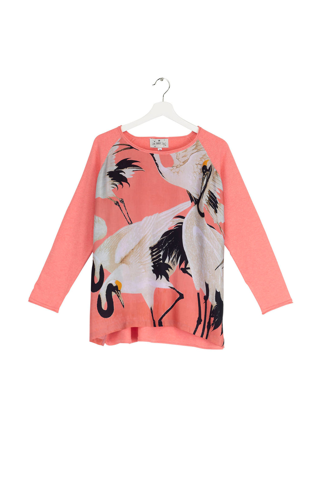 The One Hundred Stars Stork Crane Lipstick Pink cotton jerseys are perfect for the cooler months.   Here is our best selling Stork print on the front of this cool boxy Lipstick Pink jumper. 