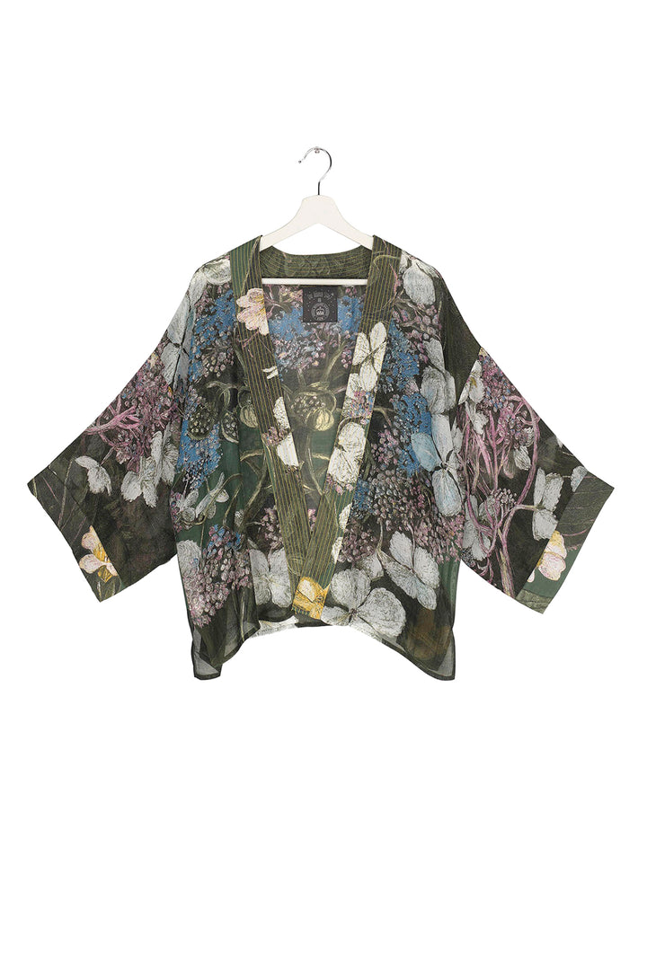 Marianne North Hydrangea Forest Kimono- Our bestselling kimono jackets have loose ¾ length sleeves, an open front and a lightly embroidered lapel. Pair with a matching camisole and your favourite jeans in summer or layer over a polo neck during the cooler months.