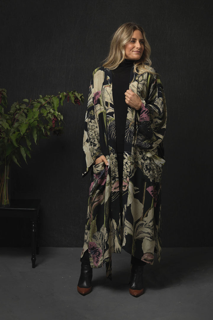 Iris Black Long Crepe Kimono- This kimono can be worn two ways, when tied at the back it makes a chic open fronted jacket. Alternatively, it can be worn tied at the front as a closed jacket or dress and secured using the interior waist tie. 