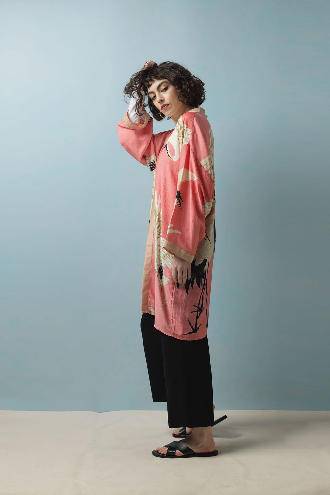The One Hundred Stars Stork Lipstick Pink mid length collar kimono create a relaxed fit silhouette.