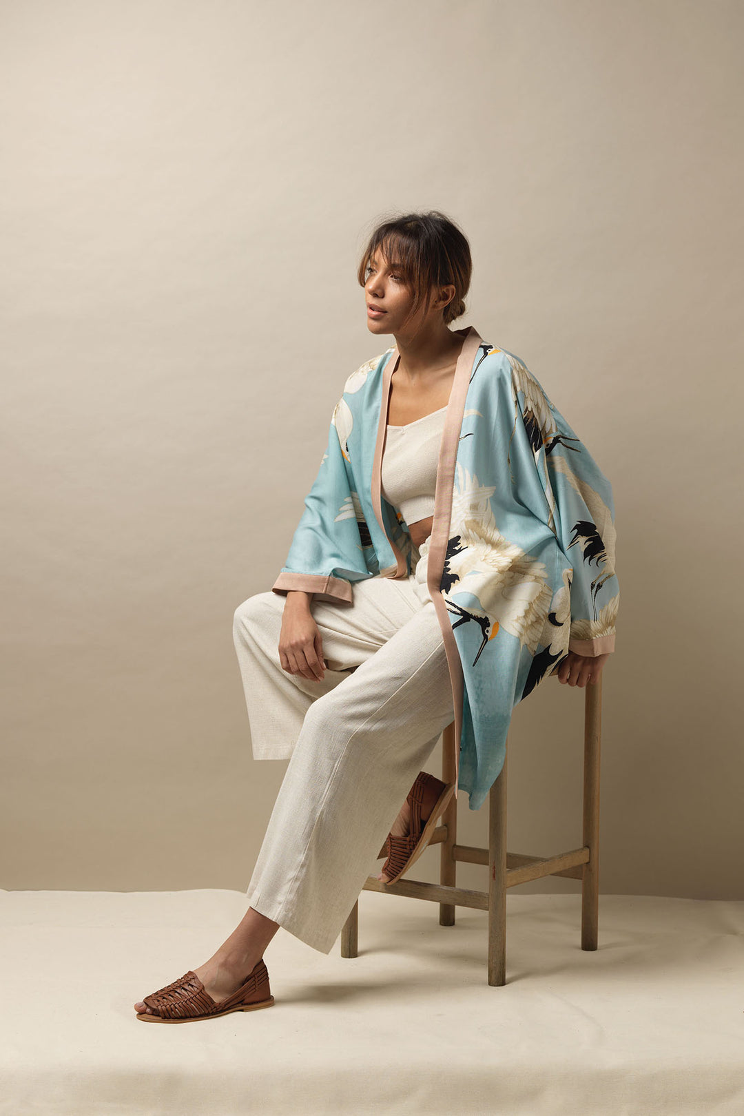 The One Hundred Stars Stork Crane Sky Blue Collar Kimono is a loose fitting mid length kimono, which can be worn as a cover up in the day or an evening jacket.  