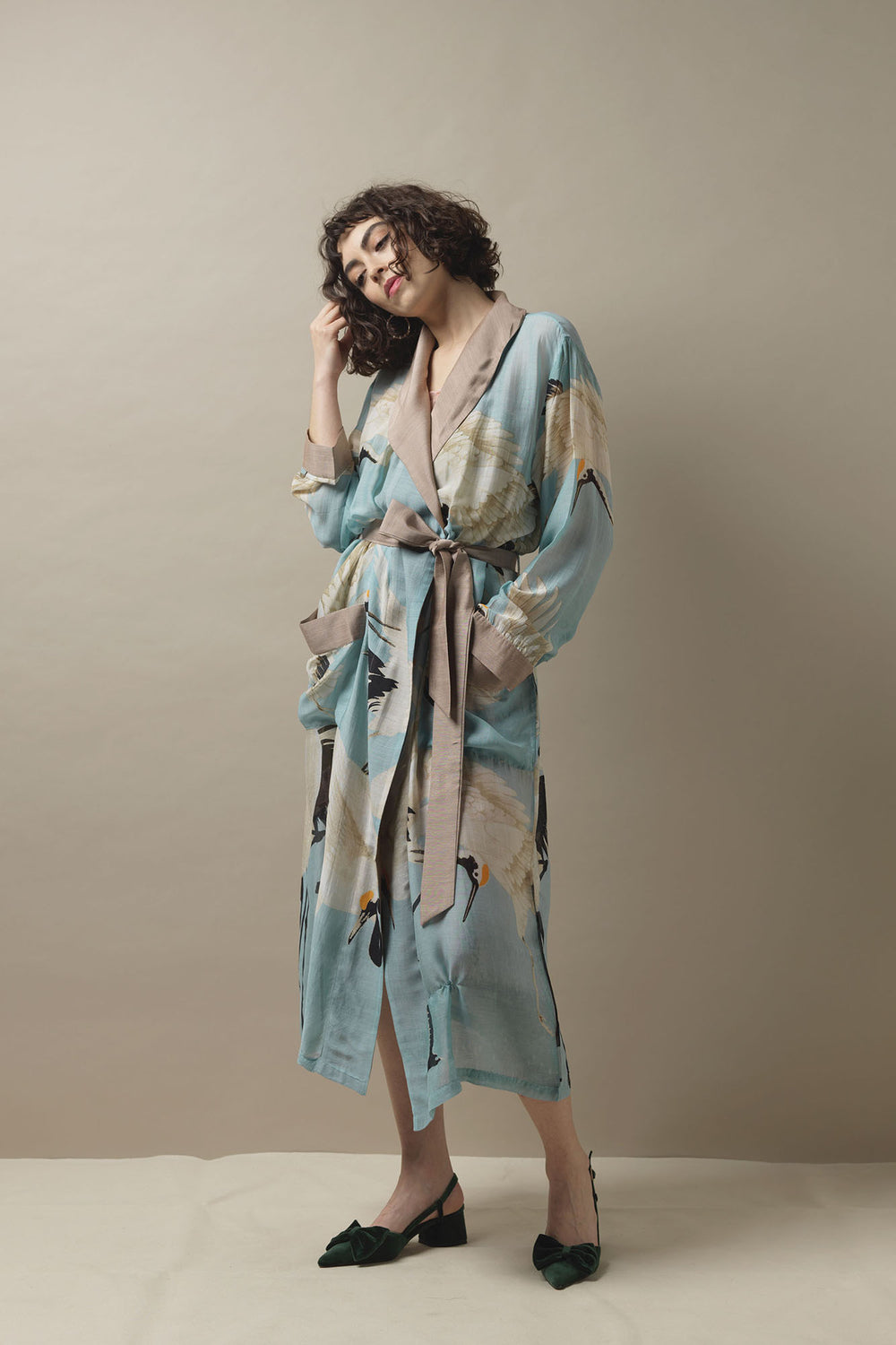 This gown is perfect as a luxurious house coat or for layering as a chic accessory to your favourite outfit.
