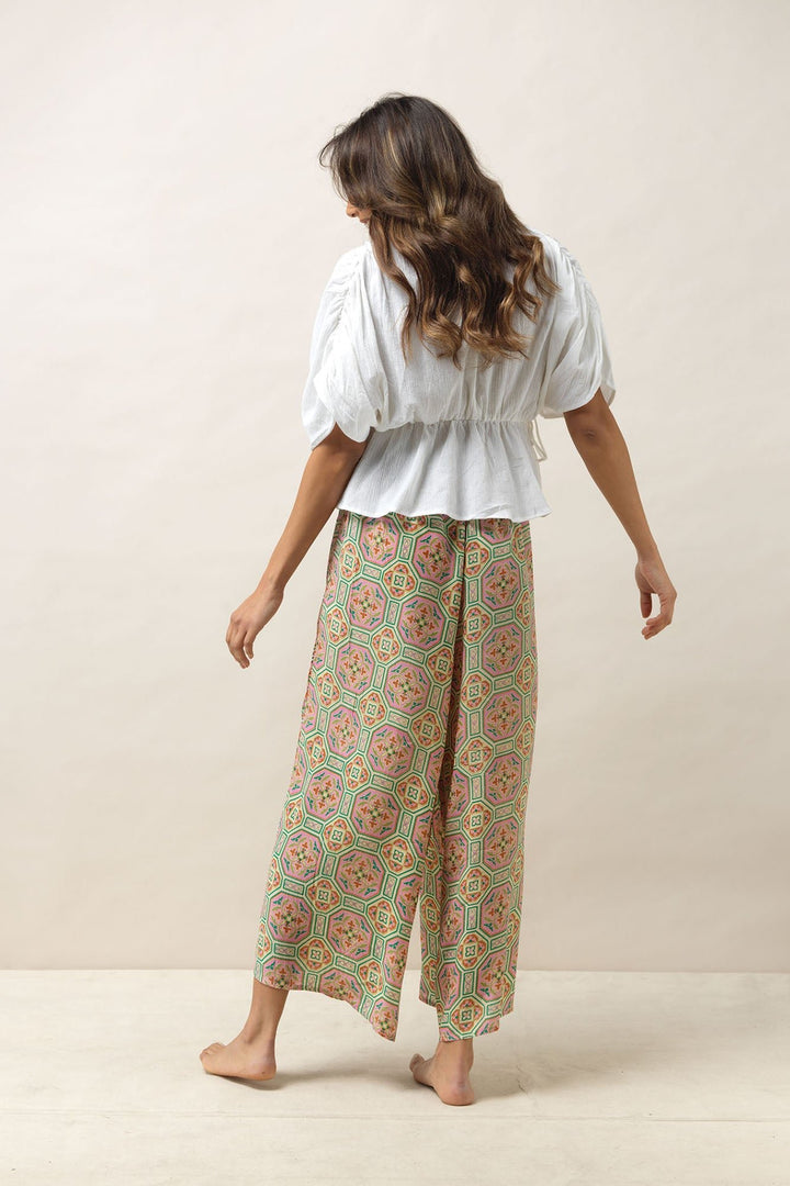 Women's palazzo trouser pants in a vintage tiles pink print by One Hundred Stars