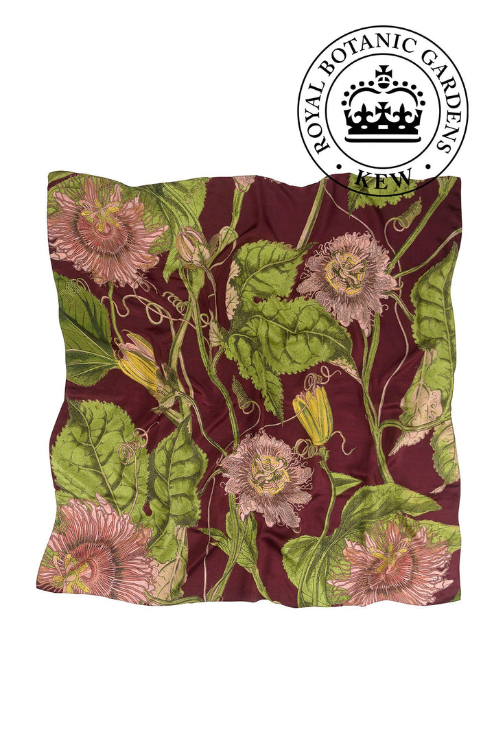 KEW Passion Flower Burgundy Silk Square Scarf- 100% silk, 100% hand screen printed and a whole 100cm x 100cm of print, this silk scarf oozes luxury whether you wear it knotted around your neck, as a headscarf or fastened around the handle of your favourite handbag. 
